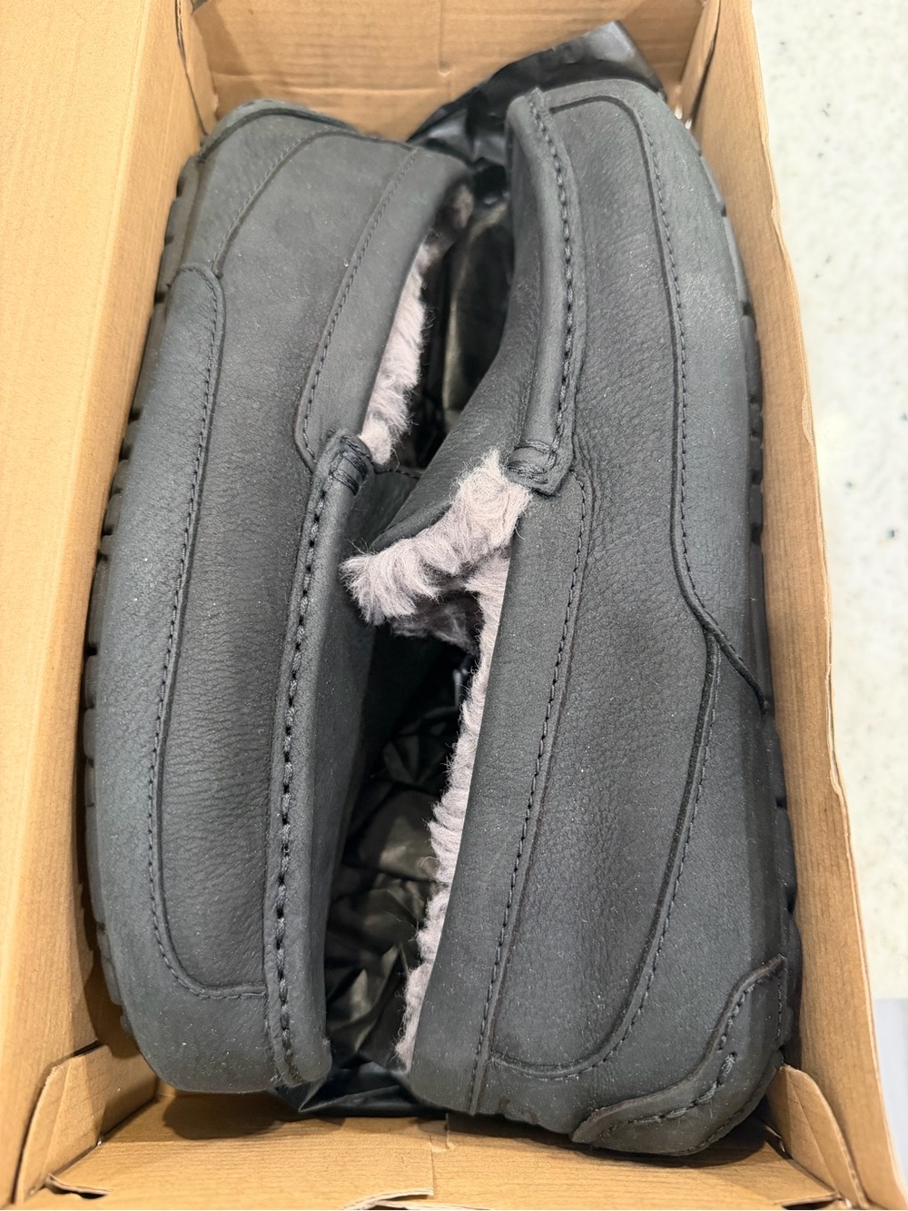 UGG Men's Black Suede Moccasin Slippers with Gray Shearling Trim
